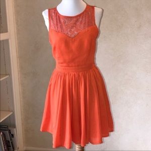 Francesca’s leshop lacy orange dress.